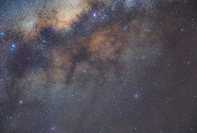 Captivating image of the Milky Way Galaxy illuminating the night sky with vibrant stars and cosmic clouds.